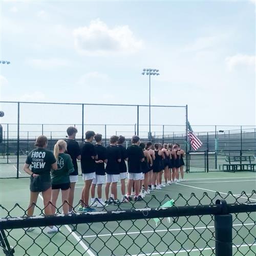 Tennis team standing in a line honoring US flag